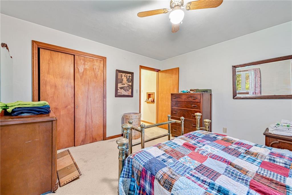 27 Matson Road Ligonier, PA 15658 - Photo 10 of 24 a bedroom with a bed and a chandelier