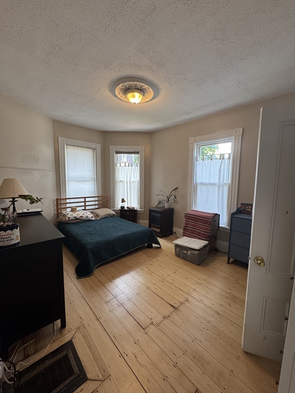 5 Spring Park Avenue, Unit 1 Boston, MA 02130 - Photo 11 of 24 a living room with furniture and a window