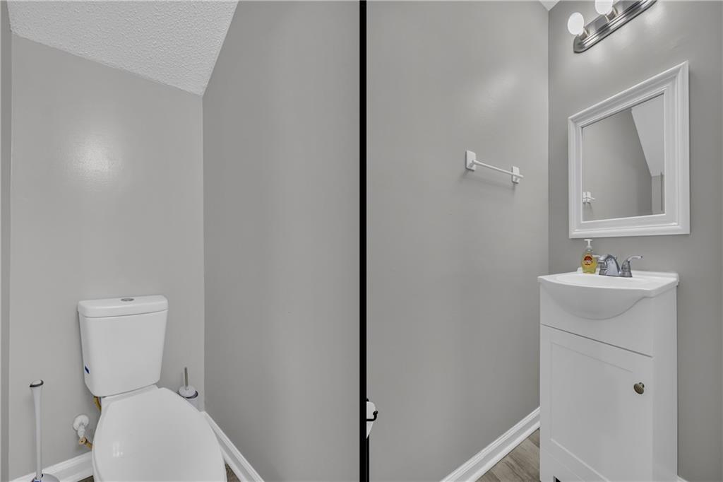 1498 Box Circle Winder, GA 30680 - Photo 24 of 56 a bathroom with a toilet sink and mirror