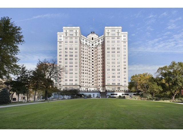 5555 North Sheridan Road, Unit 307 Chicago, IL 60640 - Photo 1 of 10 a view of a building with a yard