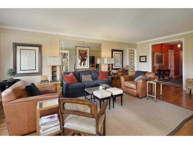 5555 North Sheridan Road, Unit 307 Chicago, IL 60640 - Photo 3 of 10 a living room with furniture and wooden floor