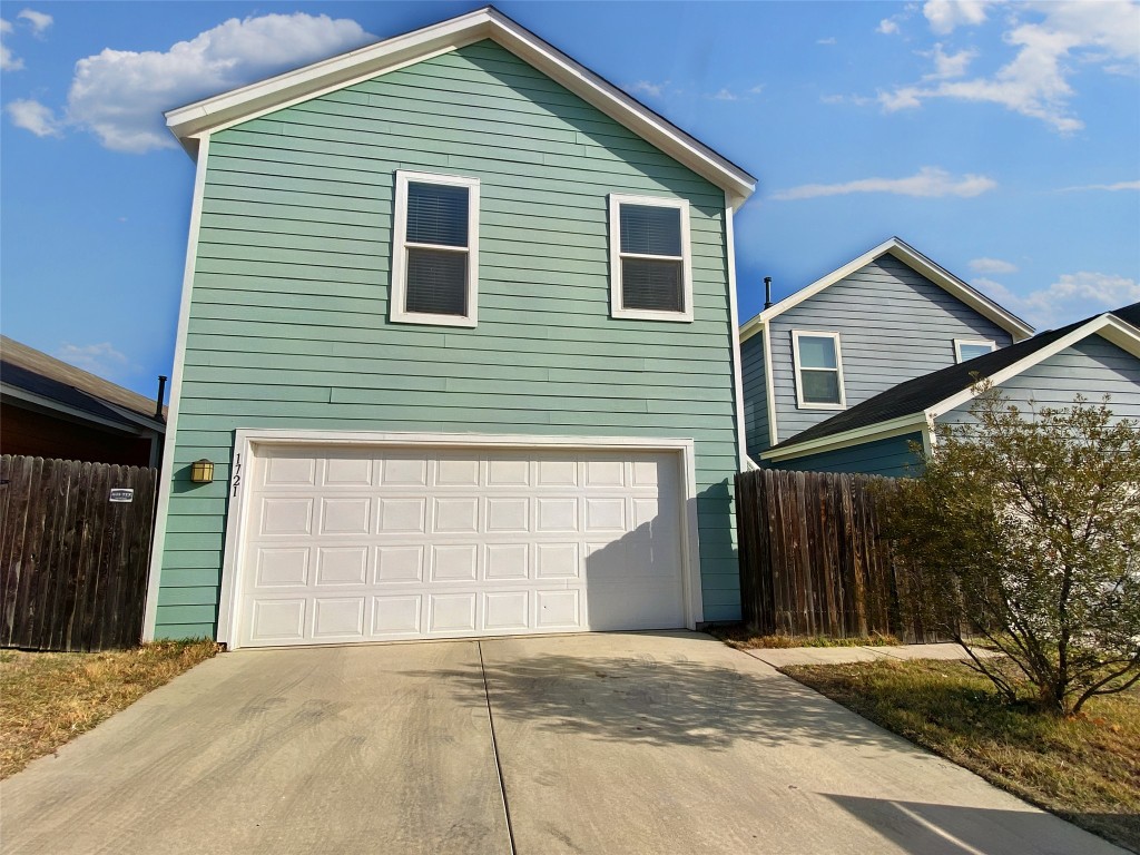 1721 Arbor Knot Drive, Unit GARAGE APARTMENT Kyle, TX 78640 - Photo 1 of 11 a front view of a house with a garage