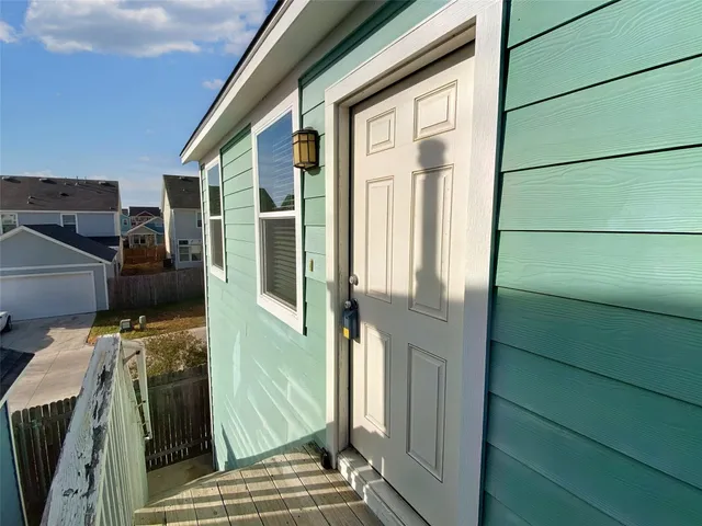 a view of a house with car parked