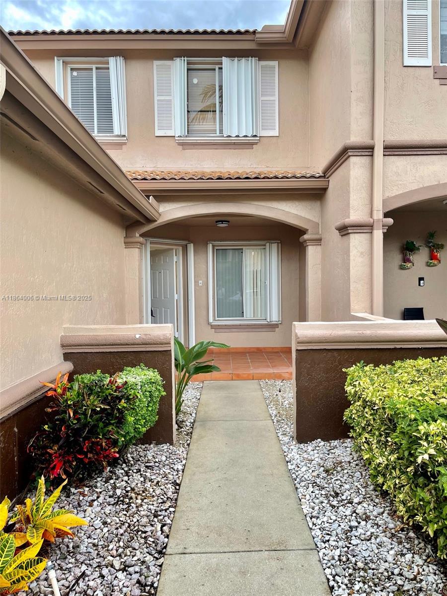 7362 Southwest 162nd Place Miami, FL 33193 - Photo 2 of 22 a front view of a house