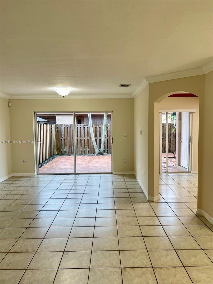 7362 Southwest 162nd Place Miami, FL 33193 - Photo 3 of 22 a view of an empty room and window