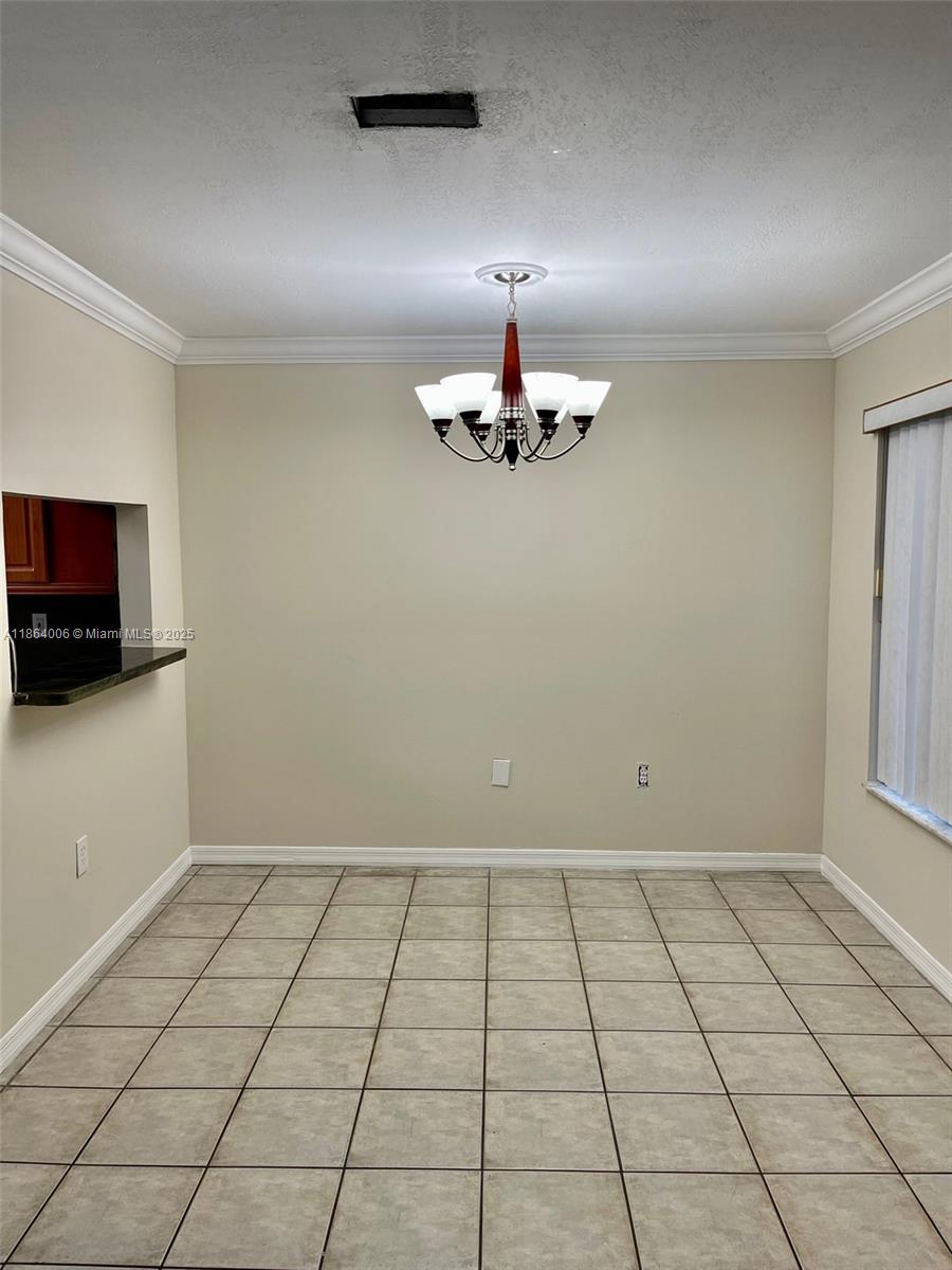 7362 Southwest 162nd Place Miami, FL 33193 - Photo 4 of 22 a view of an empty room with a window