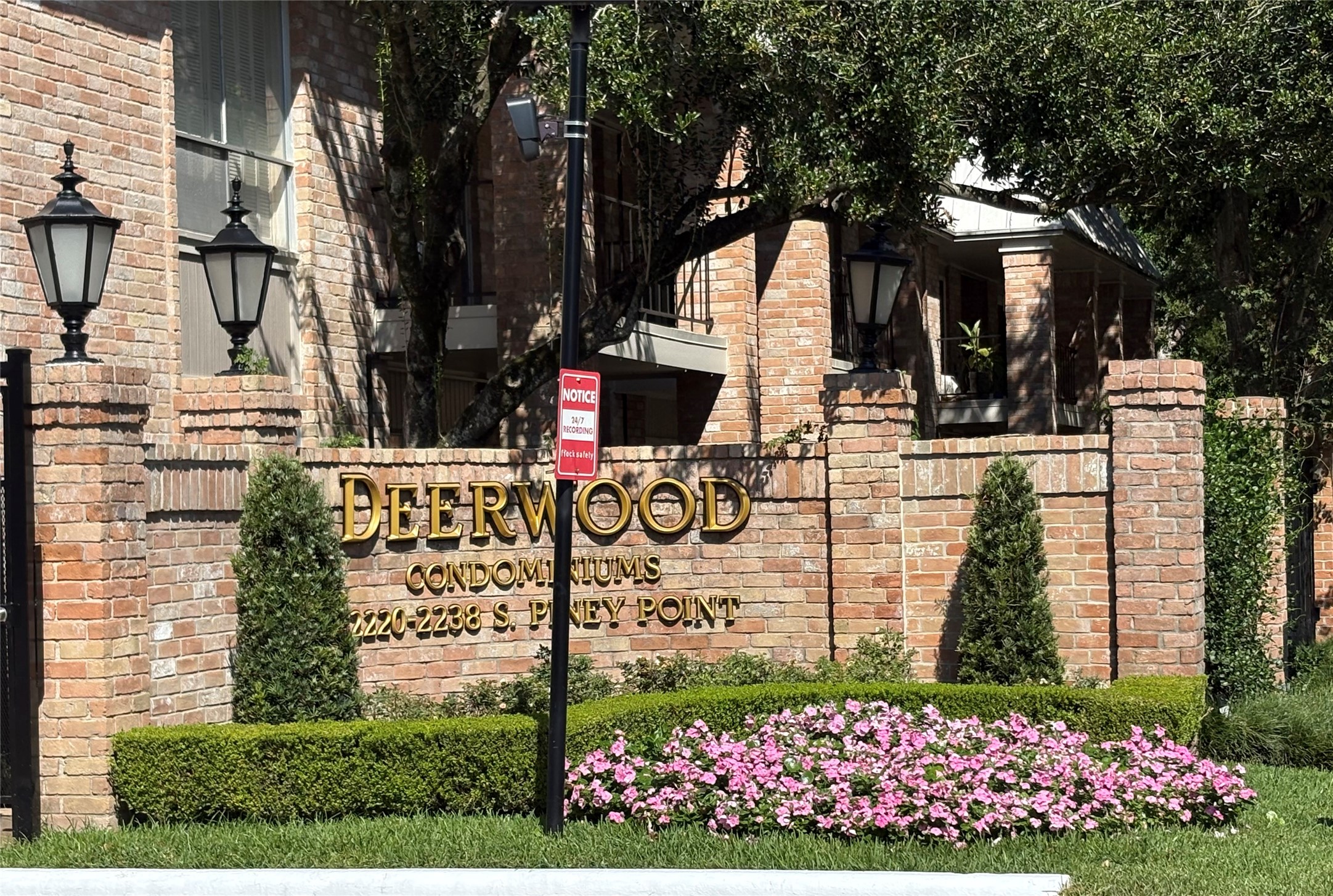 a view of a pathway house with wooden fence