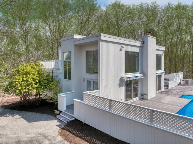 a view of a patio with table and chairs and potted plants