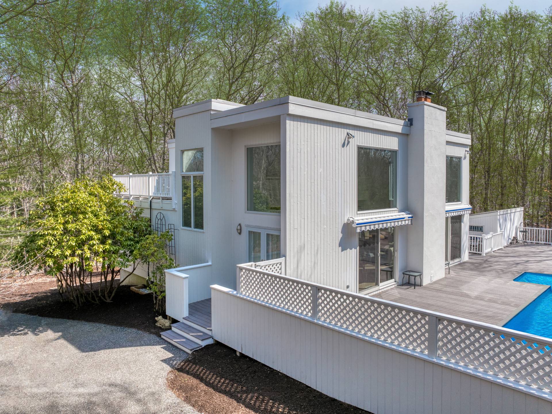 a view of a patio with table and chairs and potted plants