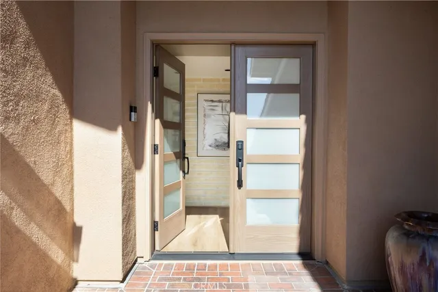 a living room with furniture fireplace and a large window