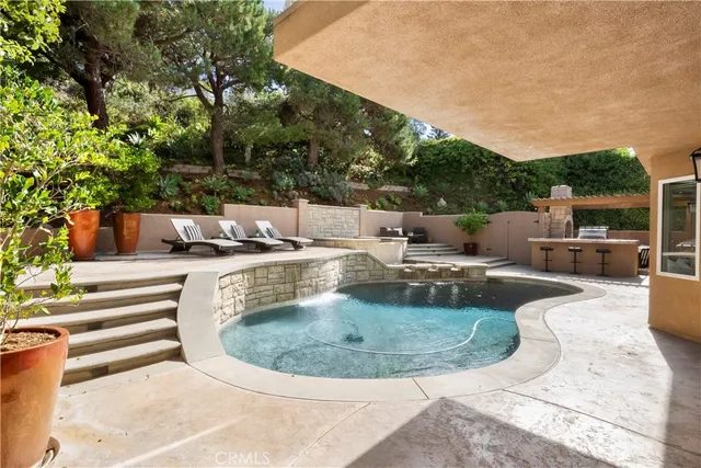 a view of a swimming pool with a patio