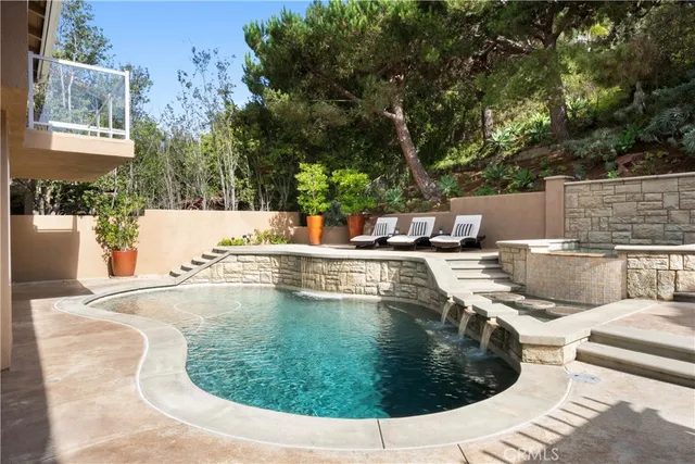 a view of a patio with table and chairs and potted plants