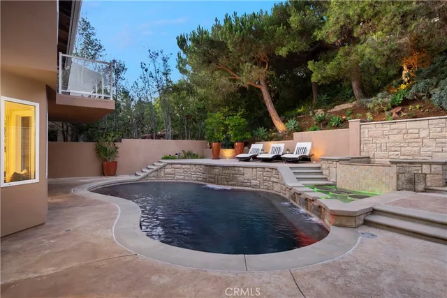 a bedroom with a bed and a potted plant