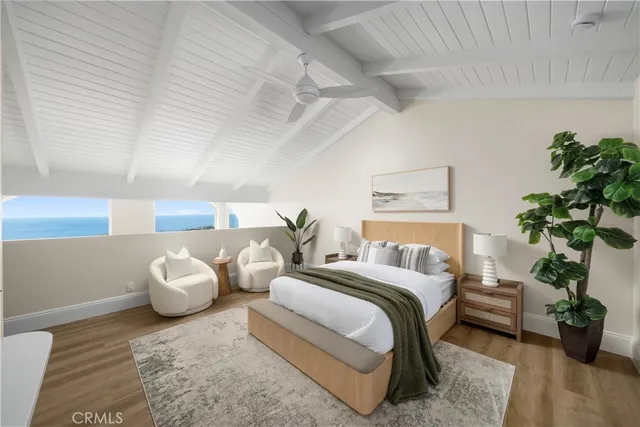 a spacious bedroom with a bed and a couch