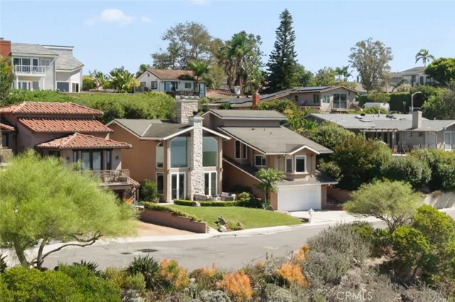 a aerial view of a house with a yard and plants
