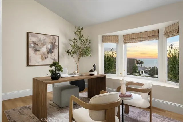 a bedroom with a bed and a potted plant