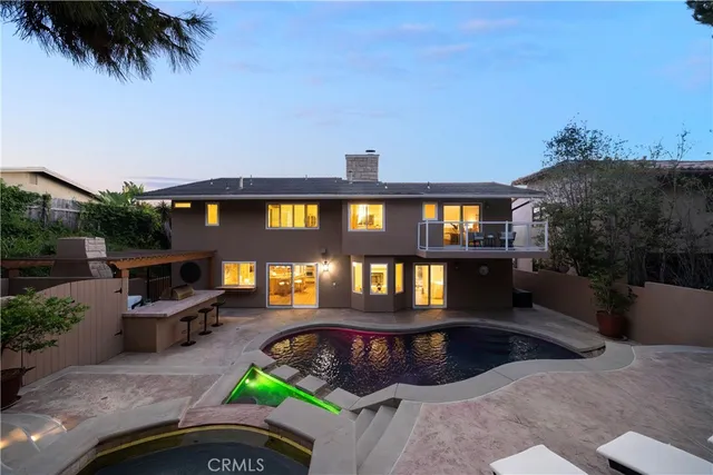 swimming pool view with a garden space
