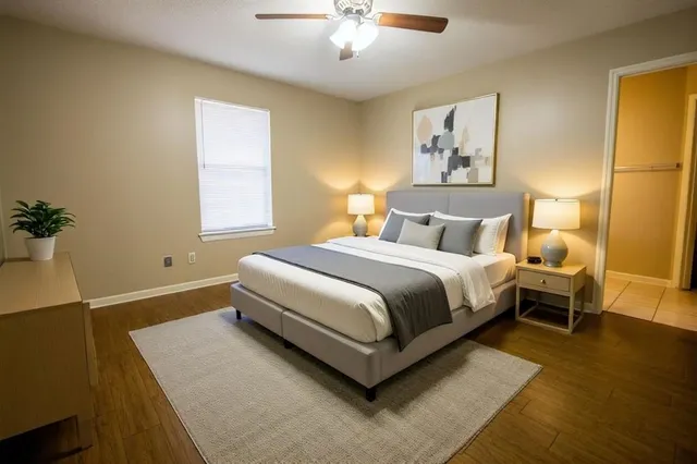 a bedroom with bed and a window