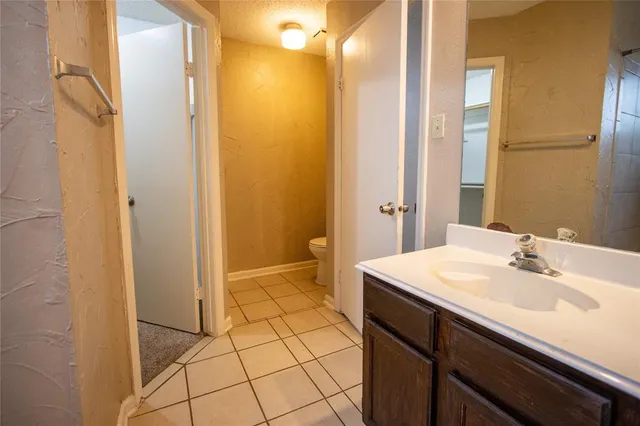 a bathroom with a sink a mirror and a shower