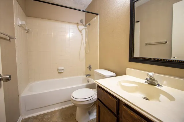 a bathroom with a sink a toilet and a bathtub