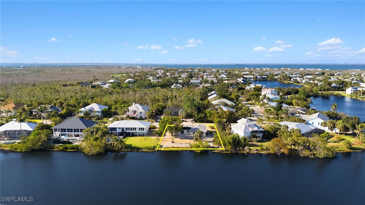 1457 Sand Castle Road Sanibel, FL 33957 - Photo 37 of 41 a view of a city with lawn chairs