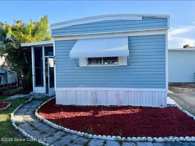 front view of a house with a tub