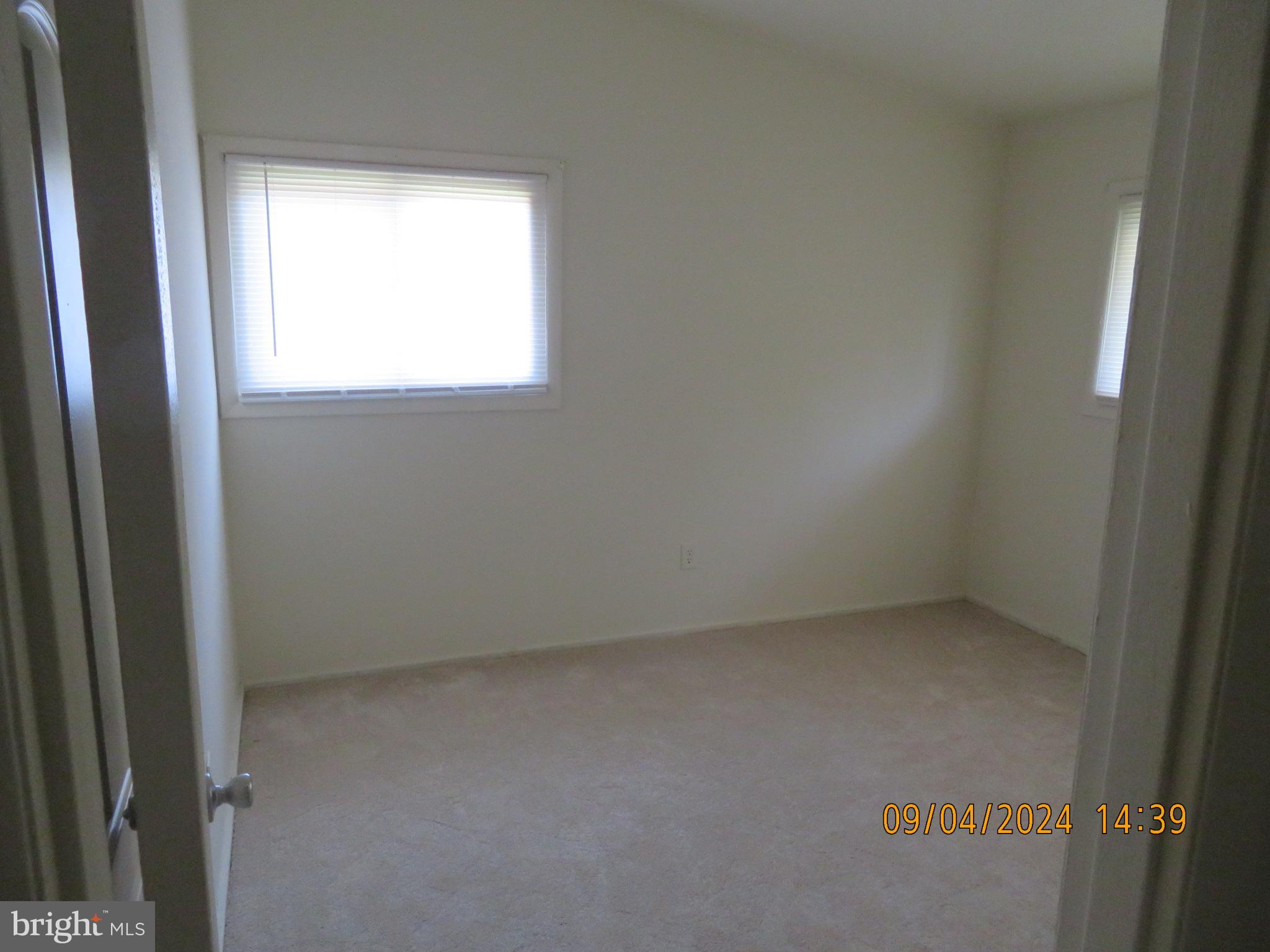 100 9th Street, Unit 305 Laurel, MD 20707 - Photo 6 of 7 a view of an empty room with a window