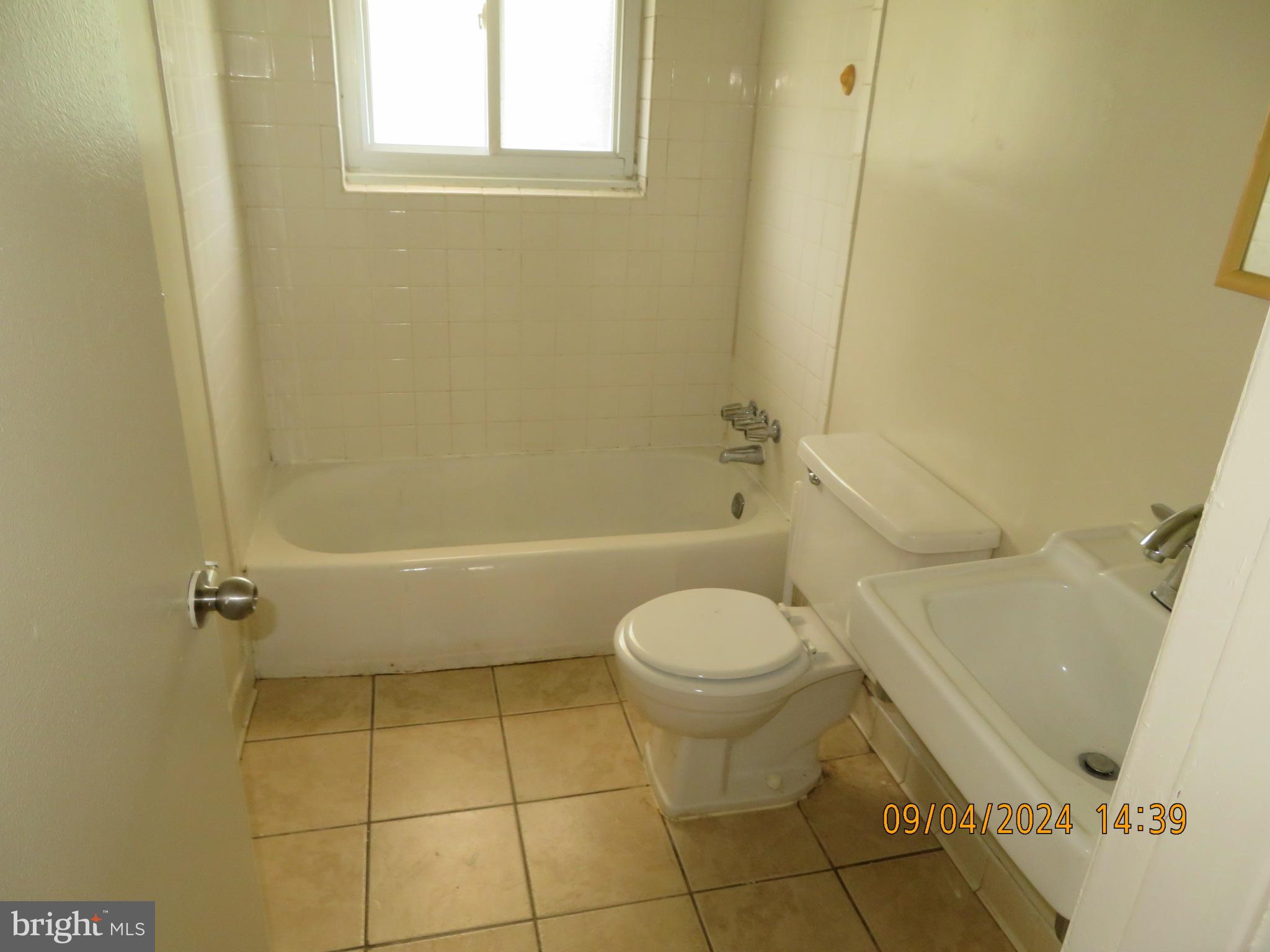 100 9th Street, Unit 305 Laurel, MD 20707 - Photo 7 of 7 a bathroom with a toilet and a shower