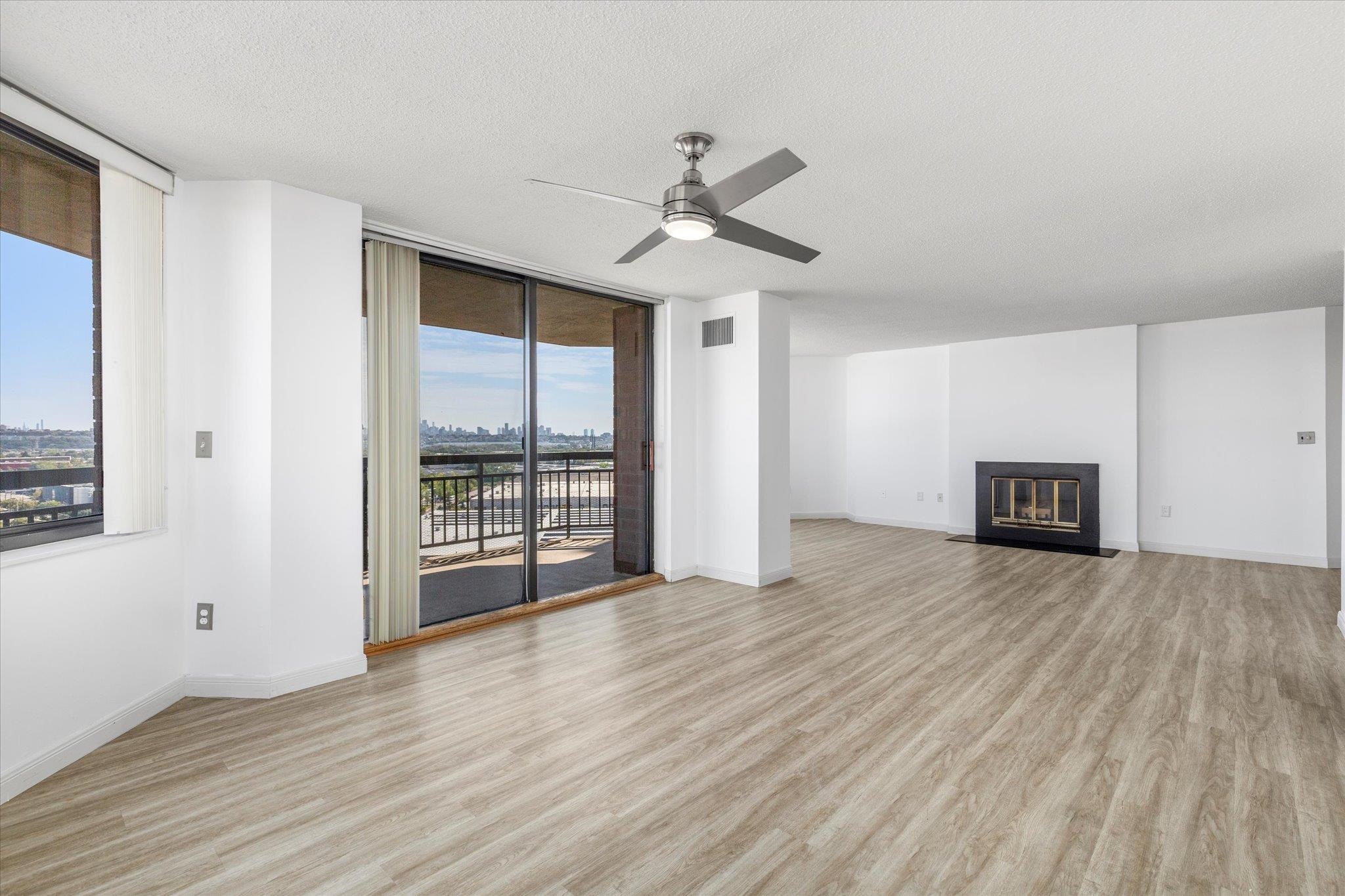 1705 Harmon Cove Tower, Unit 1705 Secaucus, NJ 07094 - Photo 21 of 49 an empty room with wooden floor and ceiling fan
