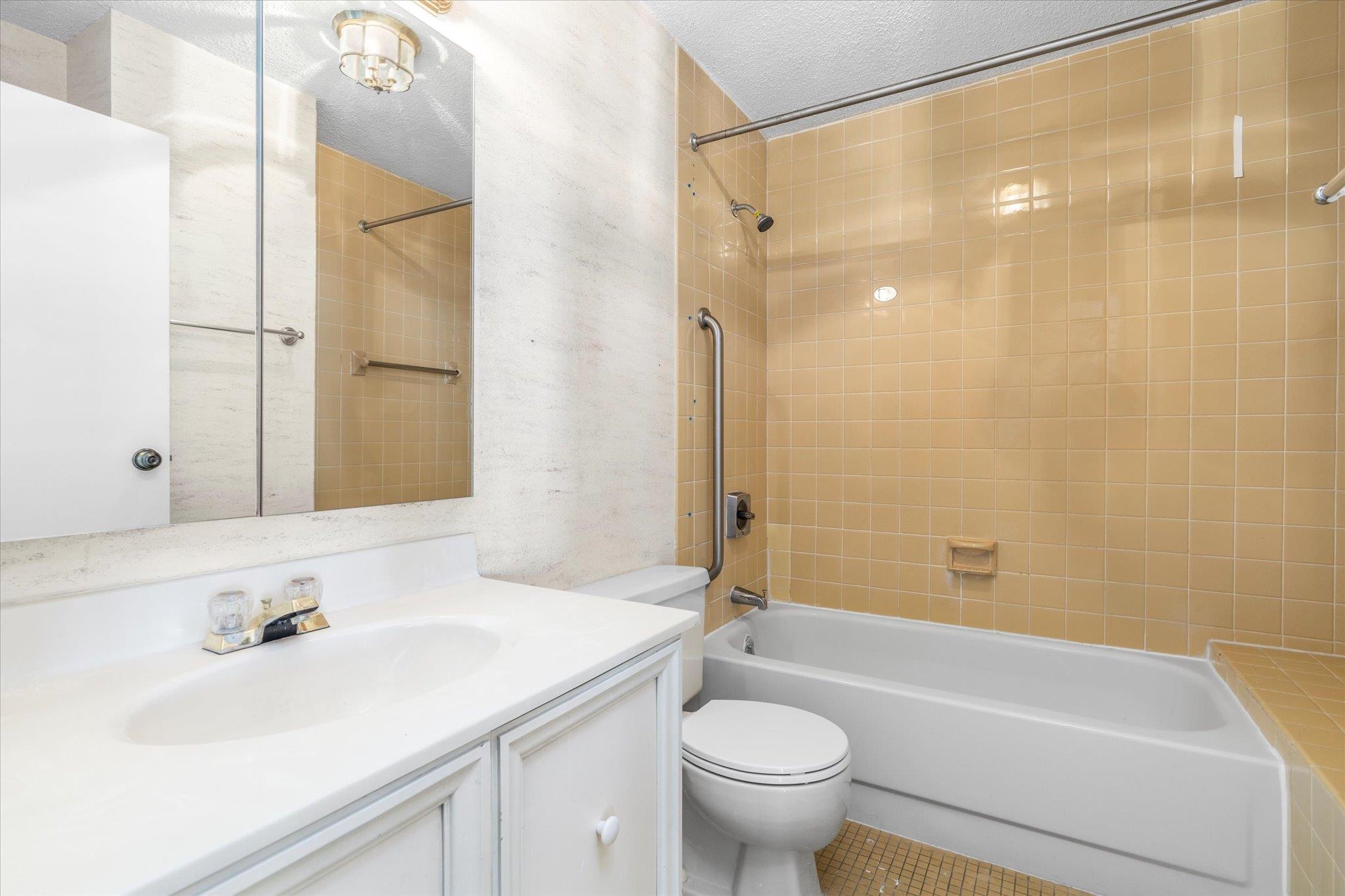 1705 Harmon Cove Tower, Unit 1705 Secaucus, NJ 07094 - Photo 23 of 49 a bathroom with a sink mirror toilet and bathtub