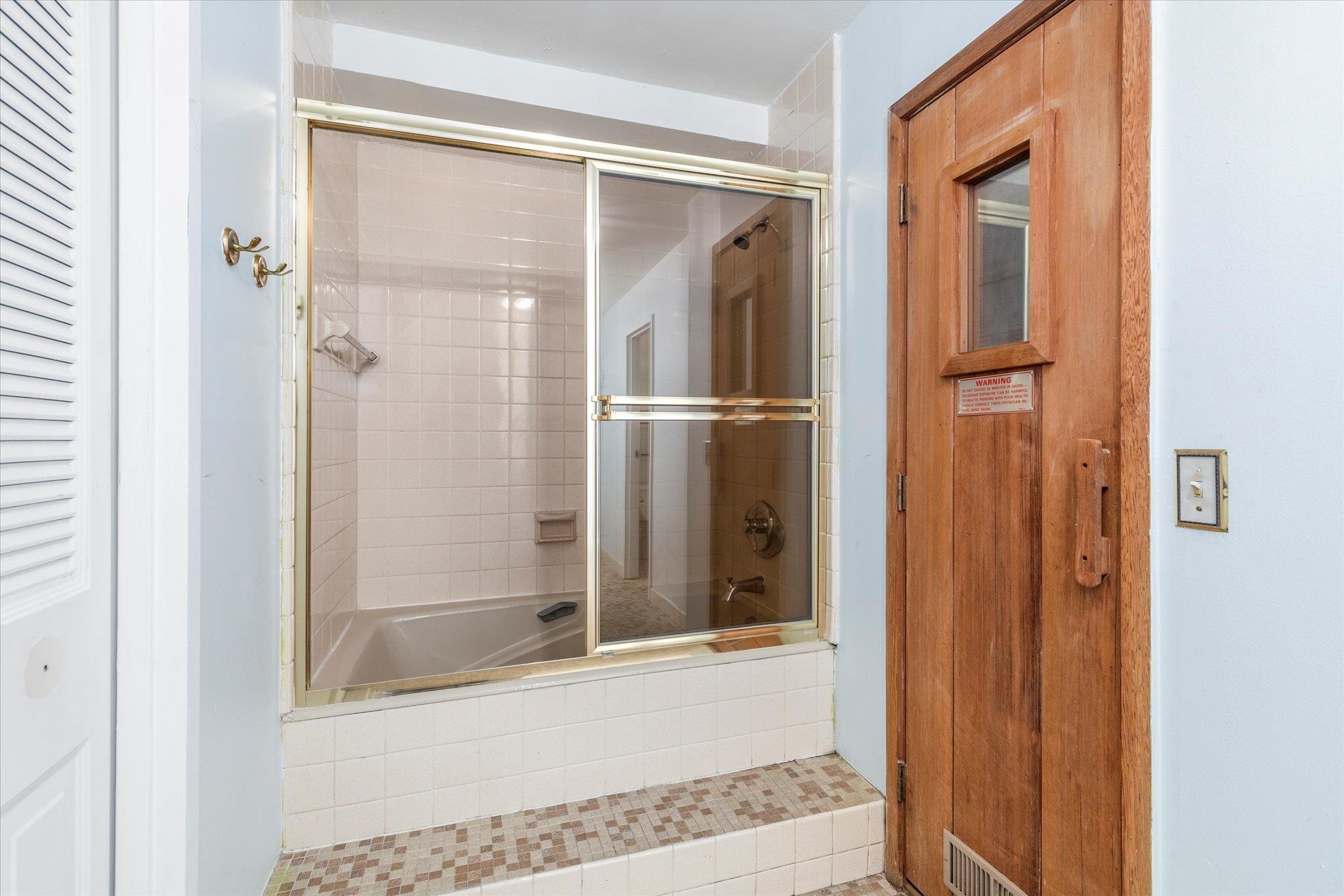 1705 Harmon Cove Tower, Unit 1705 Secaucus, NJ 07094 - Photo 27 of 49 a bathroom with a glass shower door