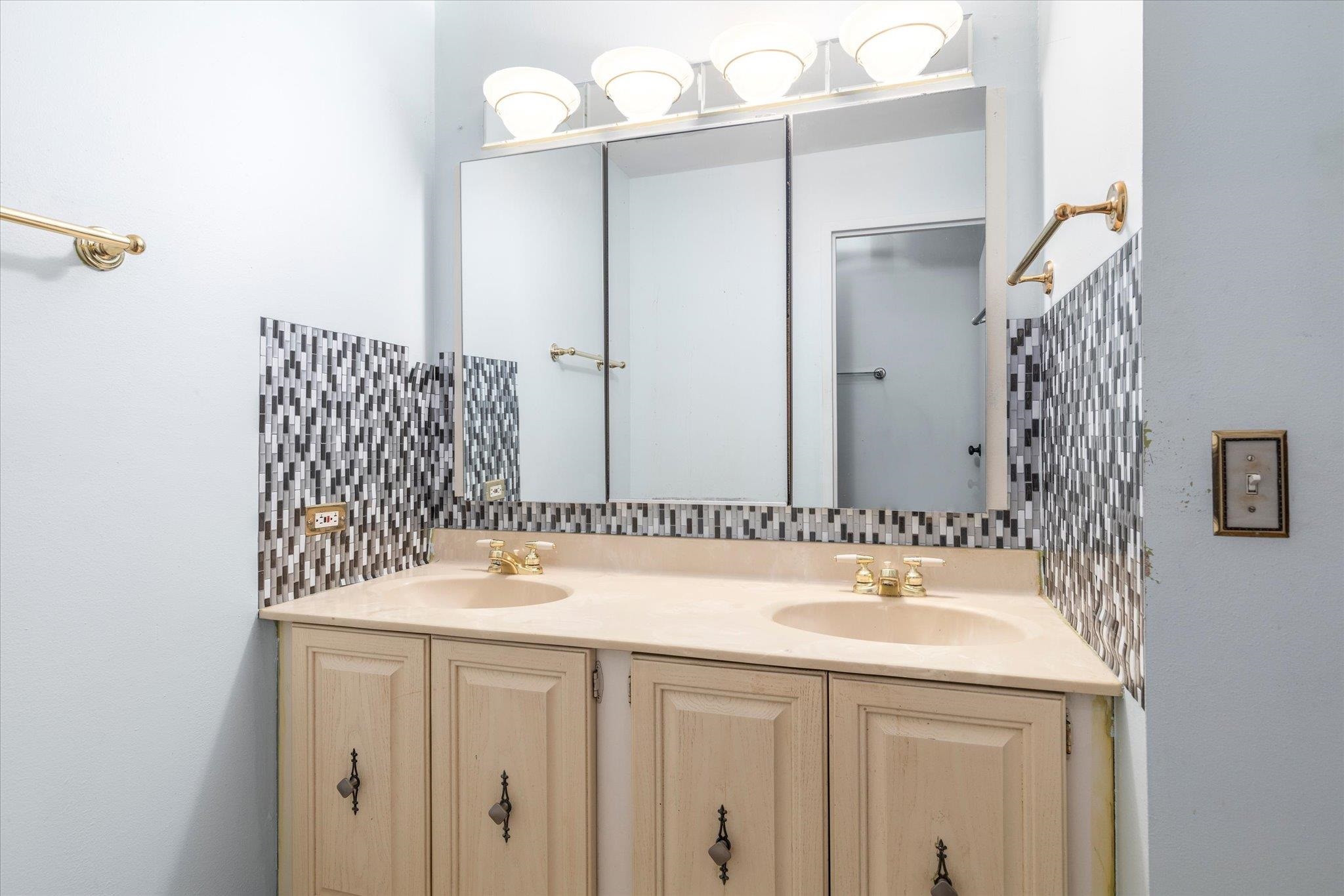 1705 Harmon Cove Tower, Unit 1705 Secaucus, NJ 07094 - Photo 29 of 49 a bathroom with a sink and a mirror