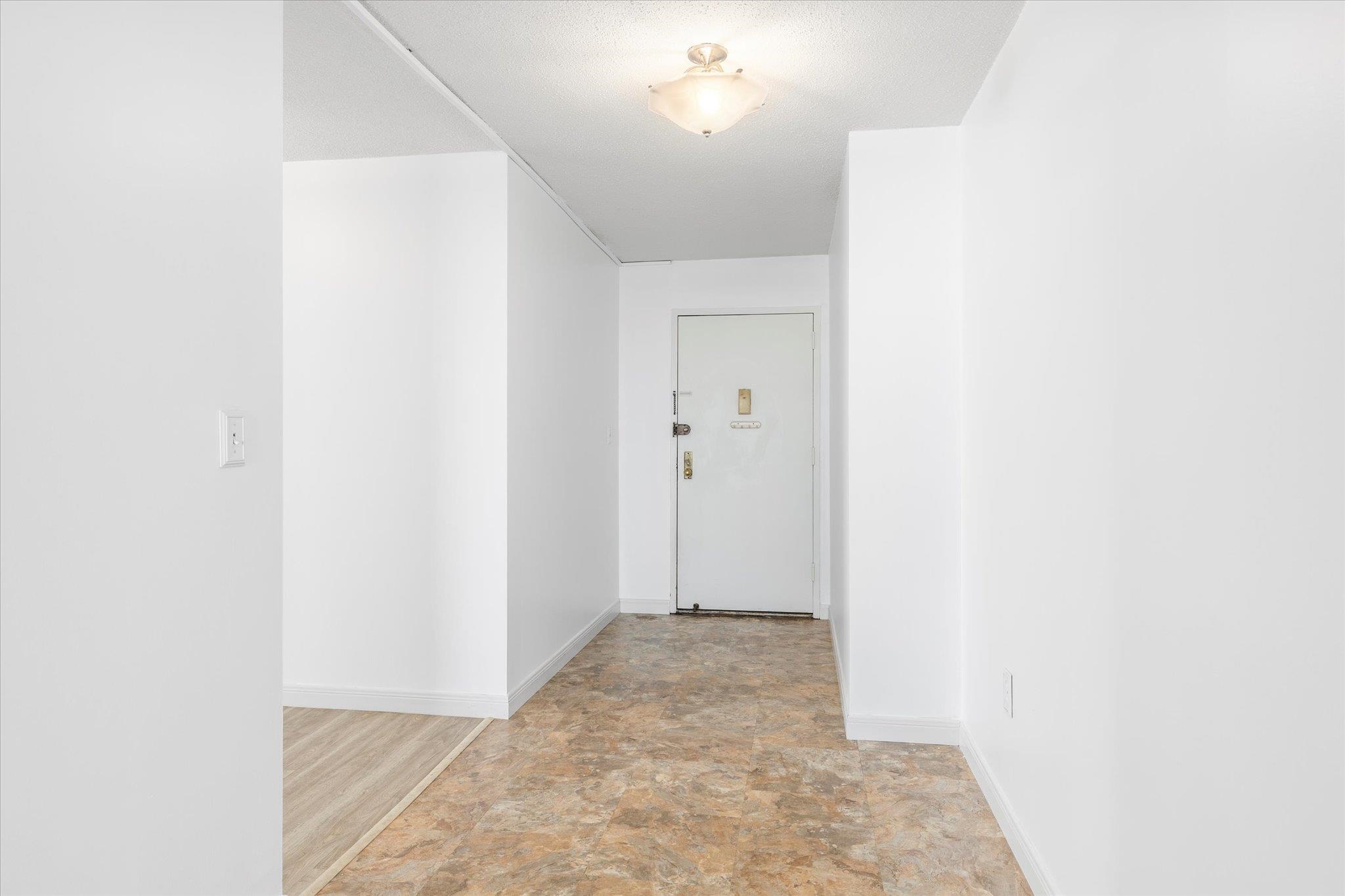 1705 Harmon Cove Tower, Unit 1705 Secaucus, NJ 07094 - Photo 3 of 49 a view of a room with a hallway