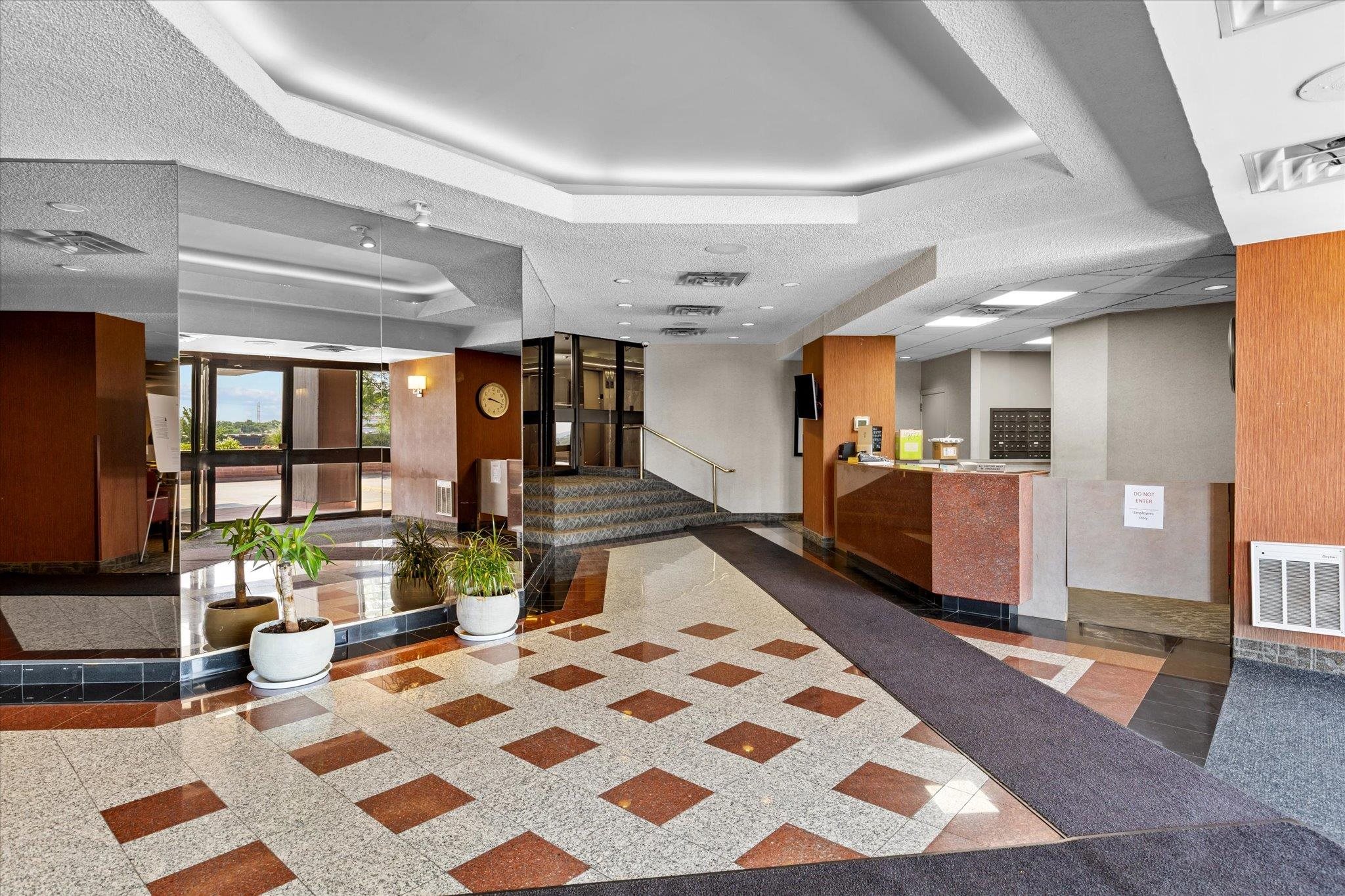 1705 Harmon Cove Tower, Unit 1705 Secaucus, NJ 07094 - Photo 33 of 49 a large room with lots of white furniture and a rug