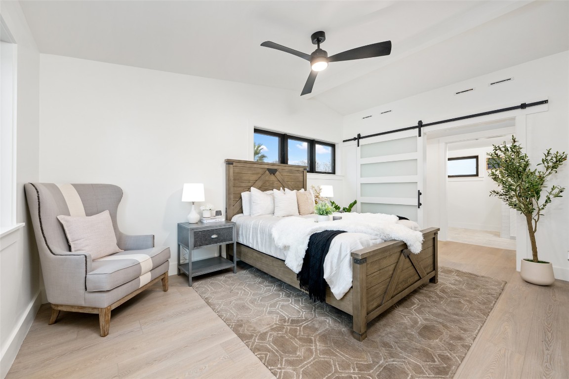 6309 Walnut Hills Drive, Unit B Austin, TX 78723 - Photo 5 of 12 a bedroom with bed and a potted plant