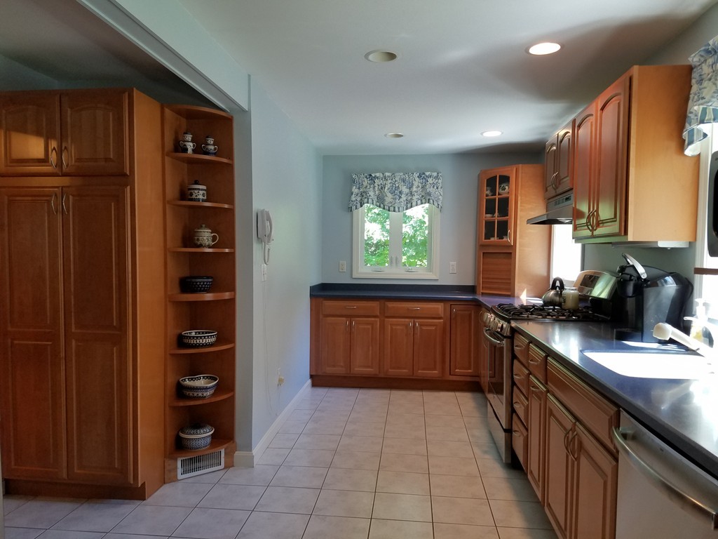110 Hunt Road Chelmsford, MA 01824 - Photo 3 of 26 a kitchen with stainless steel appliances granite countertop a refrigerator and a sink