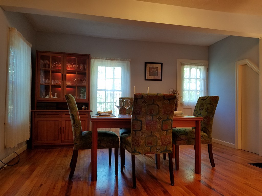 110 Hunt Road Chelmsford, MA 01824 - Photo 8 of 26 a view of a dining room with furniture and wooden floor