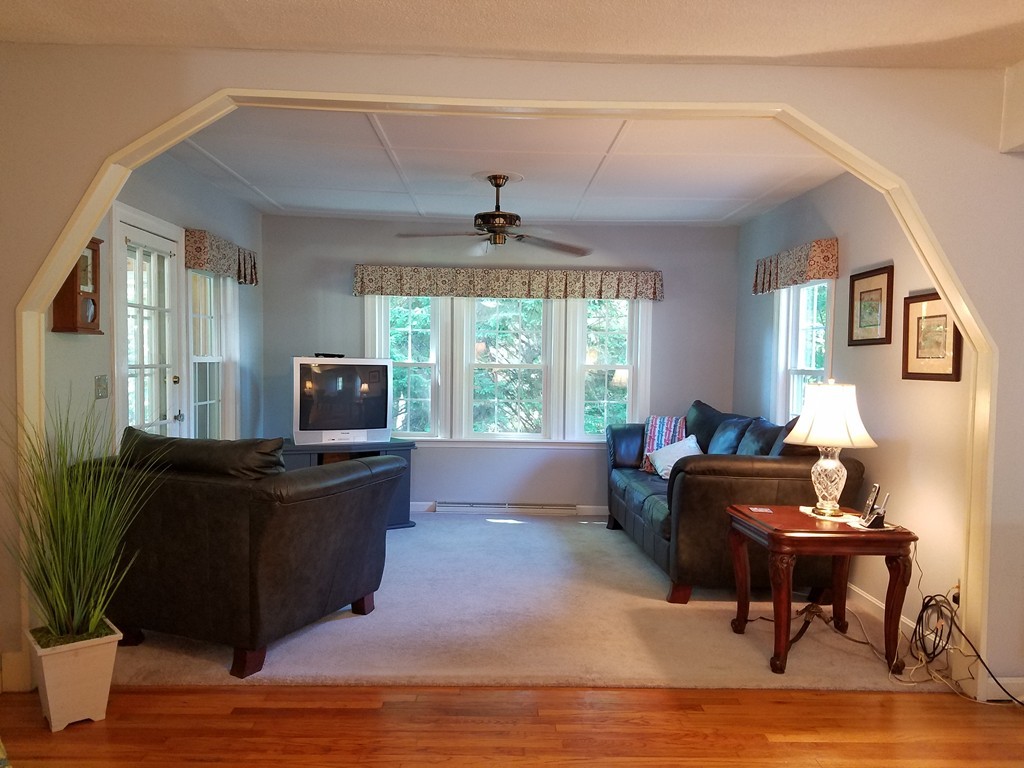 110 Hunt Road Chelmsford, MA 01824 - Photo 9 of 26 a living room with furniture and a flat screen tv