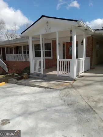 a view of a house with a fence