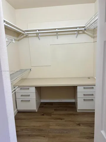 a view of an empty walk in closet