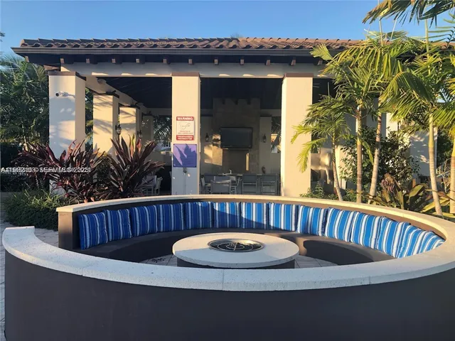 a view of outdoor sitting area with furniture and garden