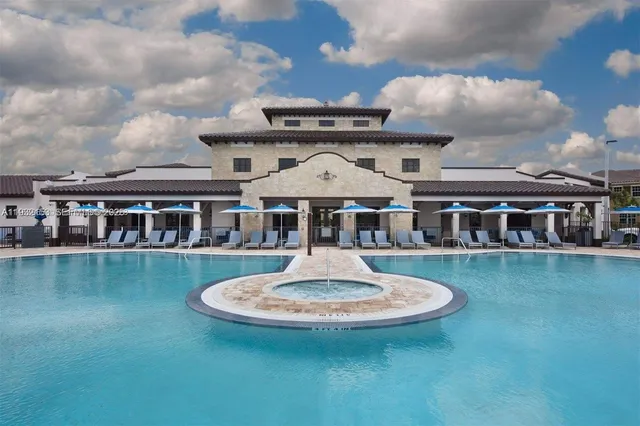 a front view of a house with a yard table and chairs
