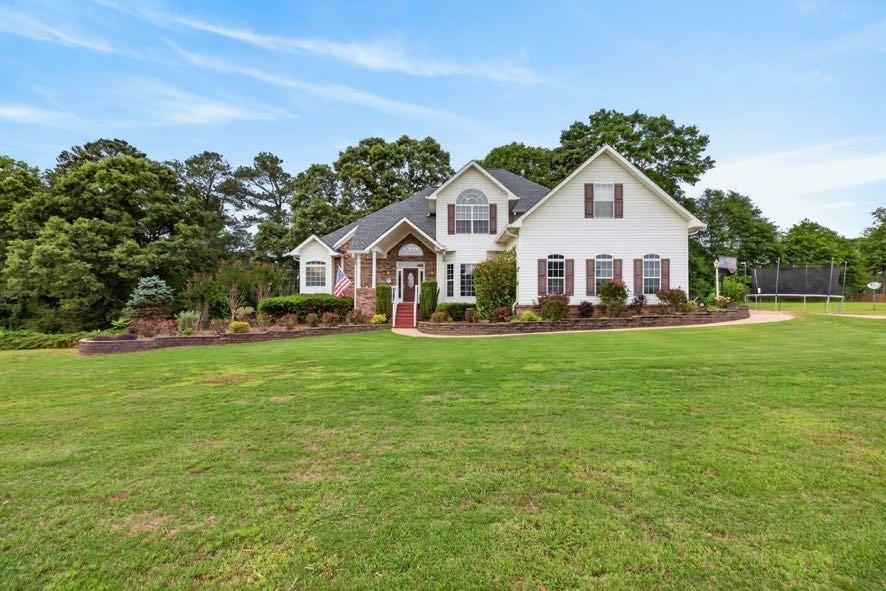 15 Fast Lane Ranburne, AL 36273 - Photo 9 of 51 a front view of a house with a garden