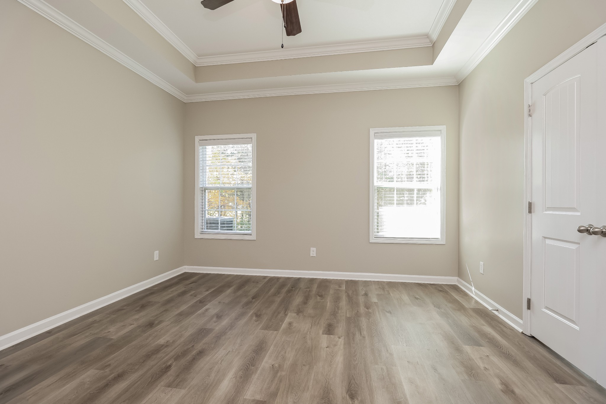 901 Beverly Court Spring Hill, TN 37174 - Photo 8 of 12 an empty room with wooden floor and windows