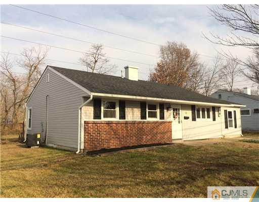 23 Colton Road Edison, NJ 08817 - Photo 1 of 12 a house view with a garden space