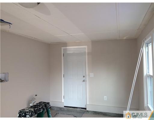23 Colton Road Edison, NJ 08817 - Photo 11 of 12 a view of entryway with wooden floor