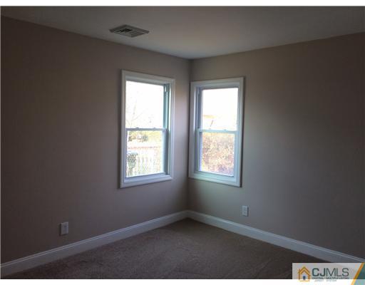23 Colton Road Edison, NJ 08817 - Photo 6 of 12 an empty room with windows