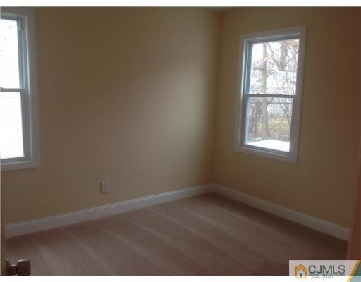 23 Colton Road Edison, NJ 08817 - Photo 7 of 12 an empty room with a window
