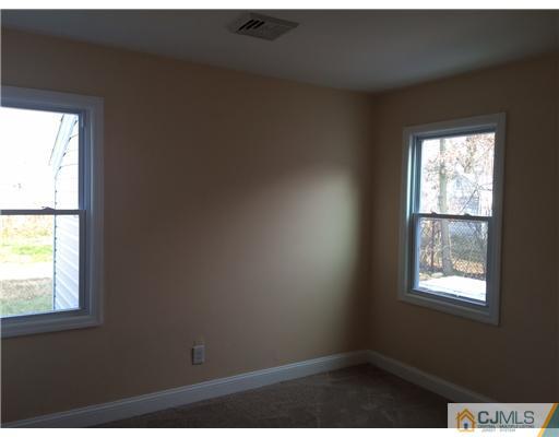 23 Colton Road Edison, NJ 08817 - Photo 8 of 12 a view of an empty room and window