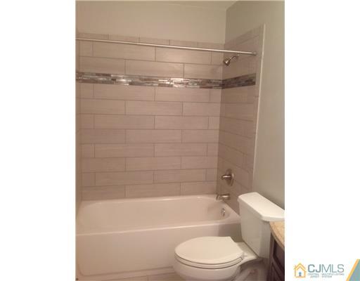 23 Colton Road Edison, NJ 08817 - Photo 9 of 12 a bathroom with a toilet and shower